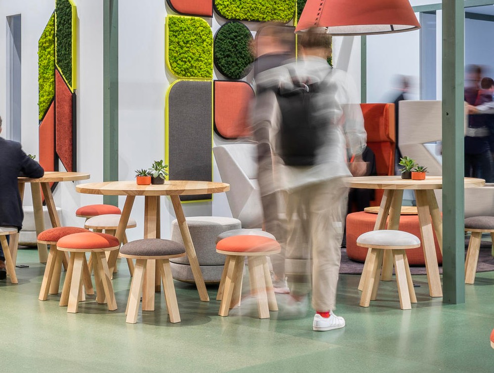 BuzziMilk Table 8 in Wood Finish with Stools in Cafeteria