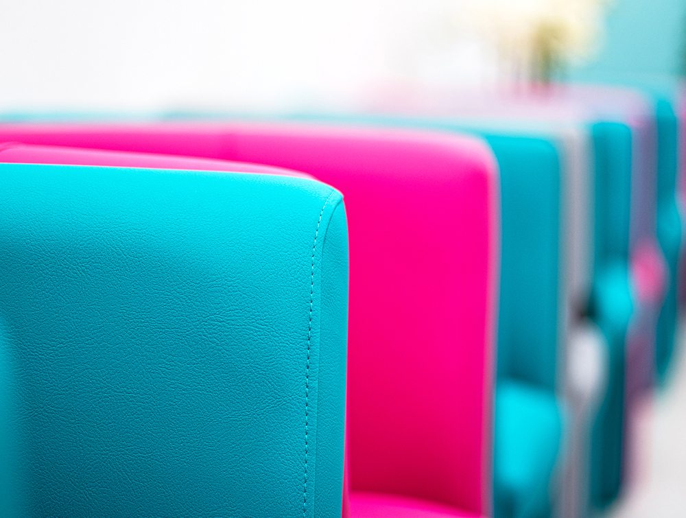 Close up of bright blue and magenta chairs