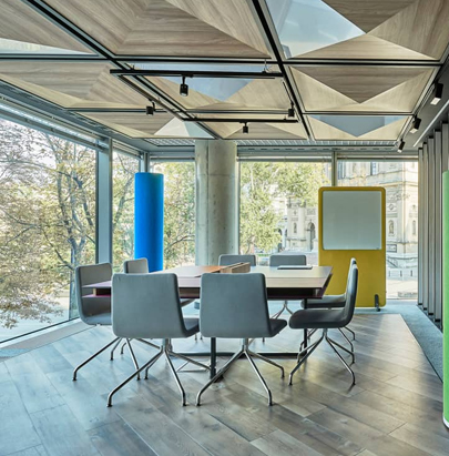 MuteDesign Wall Standing Acoustic Screen in Yellow with Wheels and Tower in Meeting Room