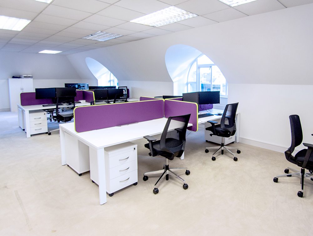 White Desks with Black Mesh Chairs and Purple Desk Dividers